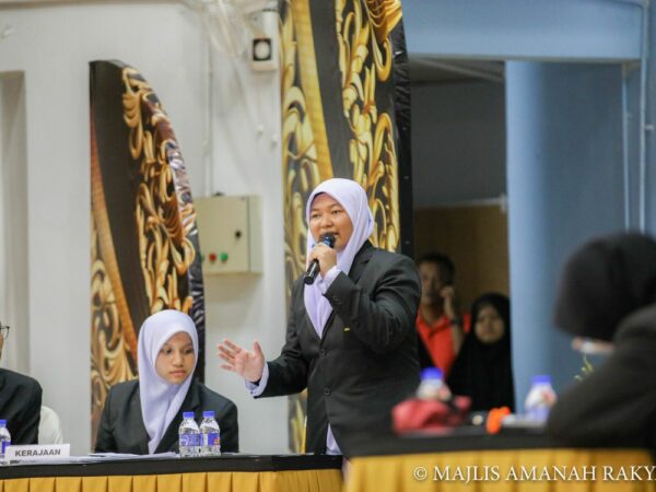 Female debate participants stand up and presenting her point of view
