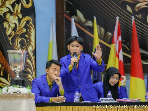Male debate participants pointing out their points of arguments