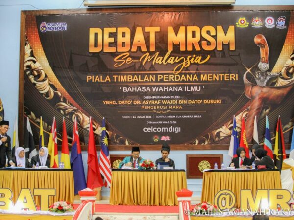 The line up of debate participants alongside moderator of event