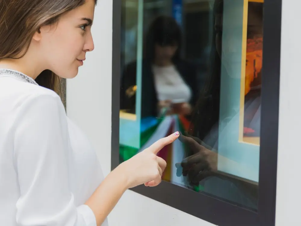 a woman interested with touchscreen kiosk001