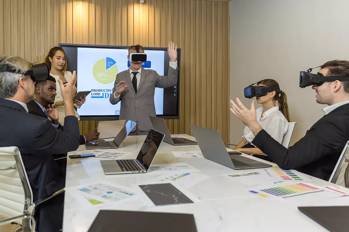 business persons with virtual reality headsets in 1200x800 1