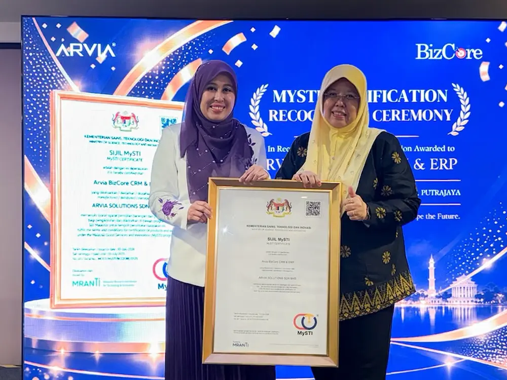 Why The Arvia Bizcore Erp Mysti Certification Matters For Your Business Arvia CEO Puan Ain and Naib Presiden Peniagawati Dr Latifah Ghazali holding the Arvia Bizcore ERP MYSTI Certification