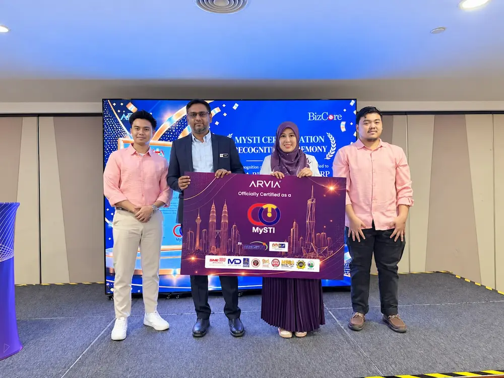 Why The Arvia Bizcore Erp Mysti Certification Matters For Your Business MOSTI handing over the Arvia Bizcore ERP MYSTI Certification foamboard mockup to Arvia Solutions