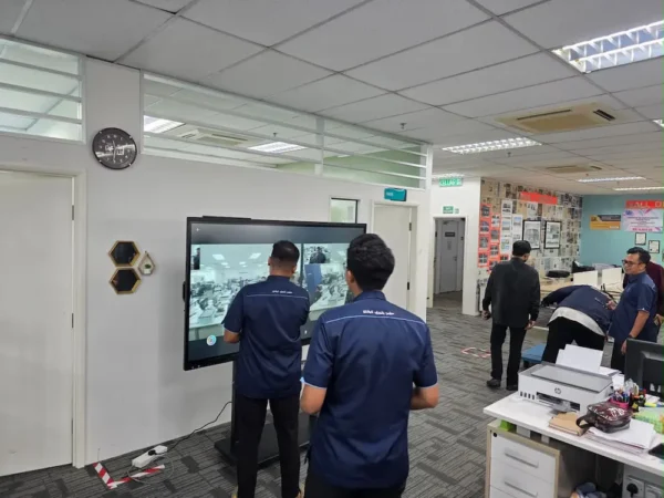 Staff testing AI auto tracking voice camera on Arvia Smartboard AI MBK Kuantan