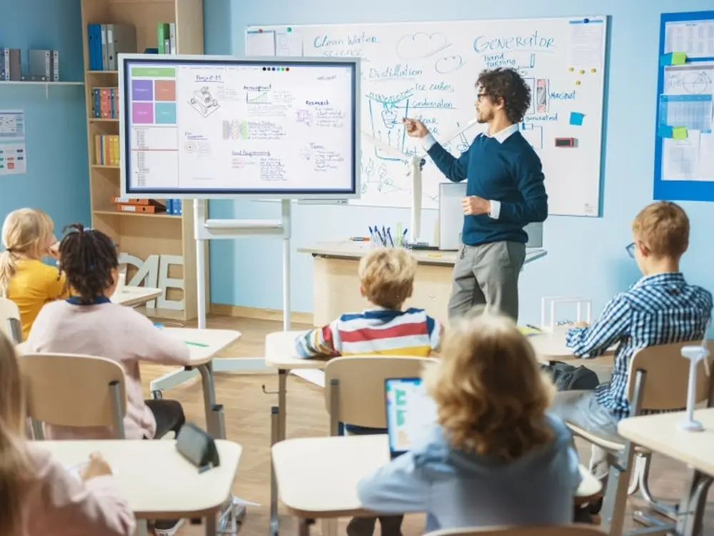 Futuristic smart classroom design with digital tools.