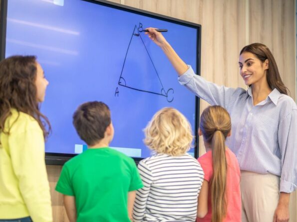 teacher drawing triangle at smartboard 1000x750 001 595x446 1